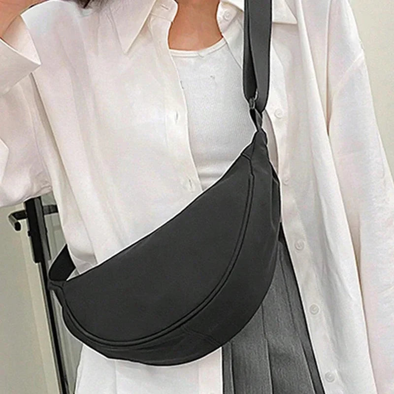 Women's bag - A round-shaped nylon bag with a cross-body strap, suitable for traveling, going to school or shopping.